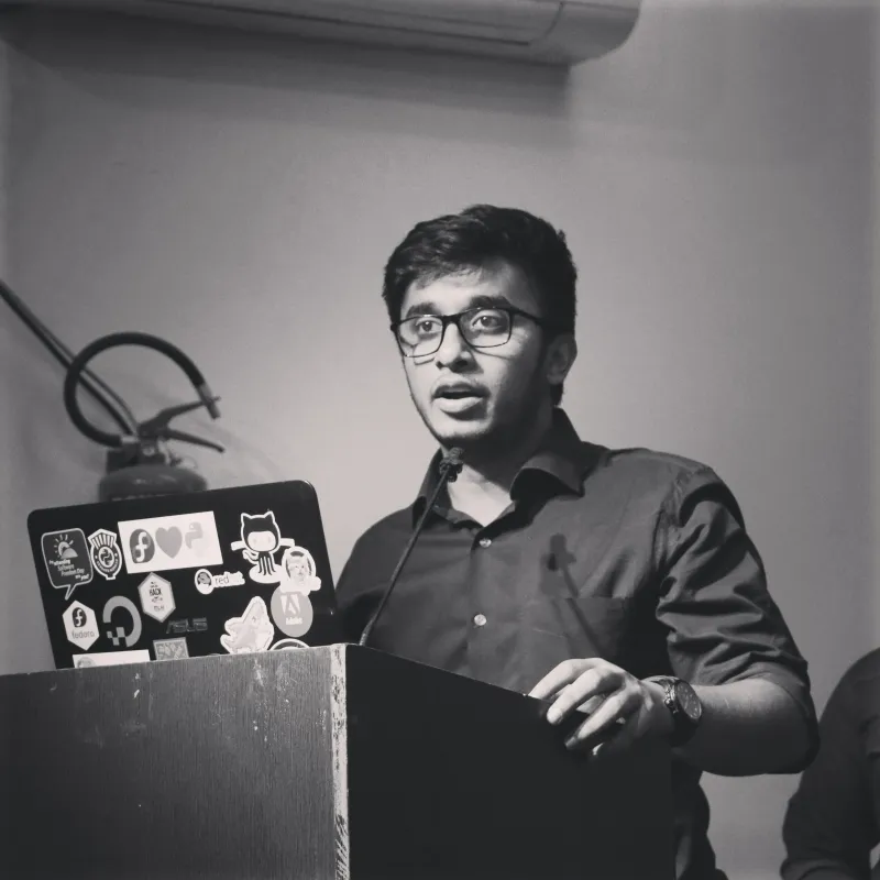 Akash speaking at a podium